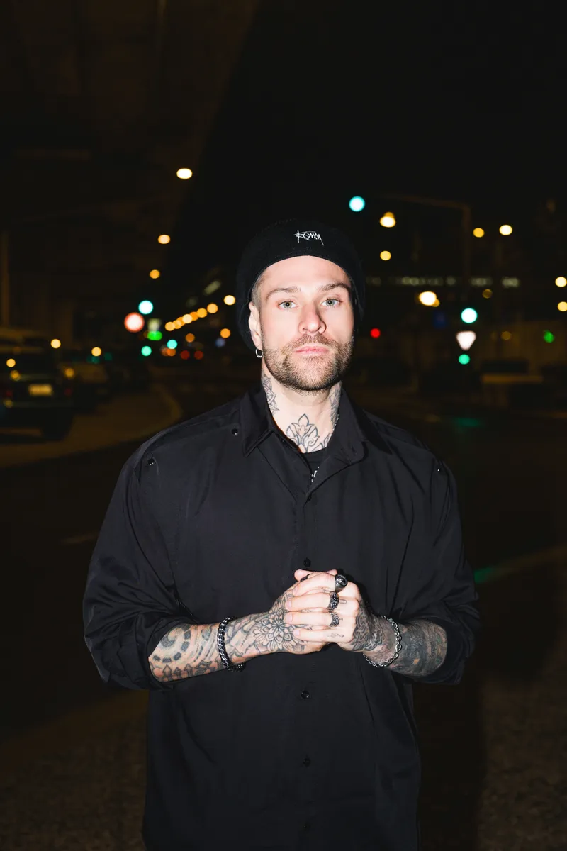 Rafael Cerato photographed on a city street at night